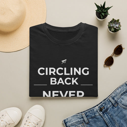 Dark chocolate unisex t-shirt with CIRCLING BACK in spaced capitals and NEVER in oversized bold type, deadpan office humor design — front view