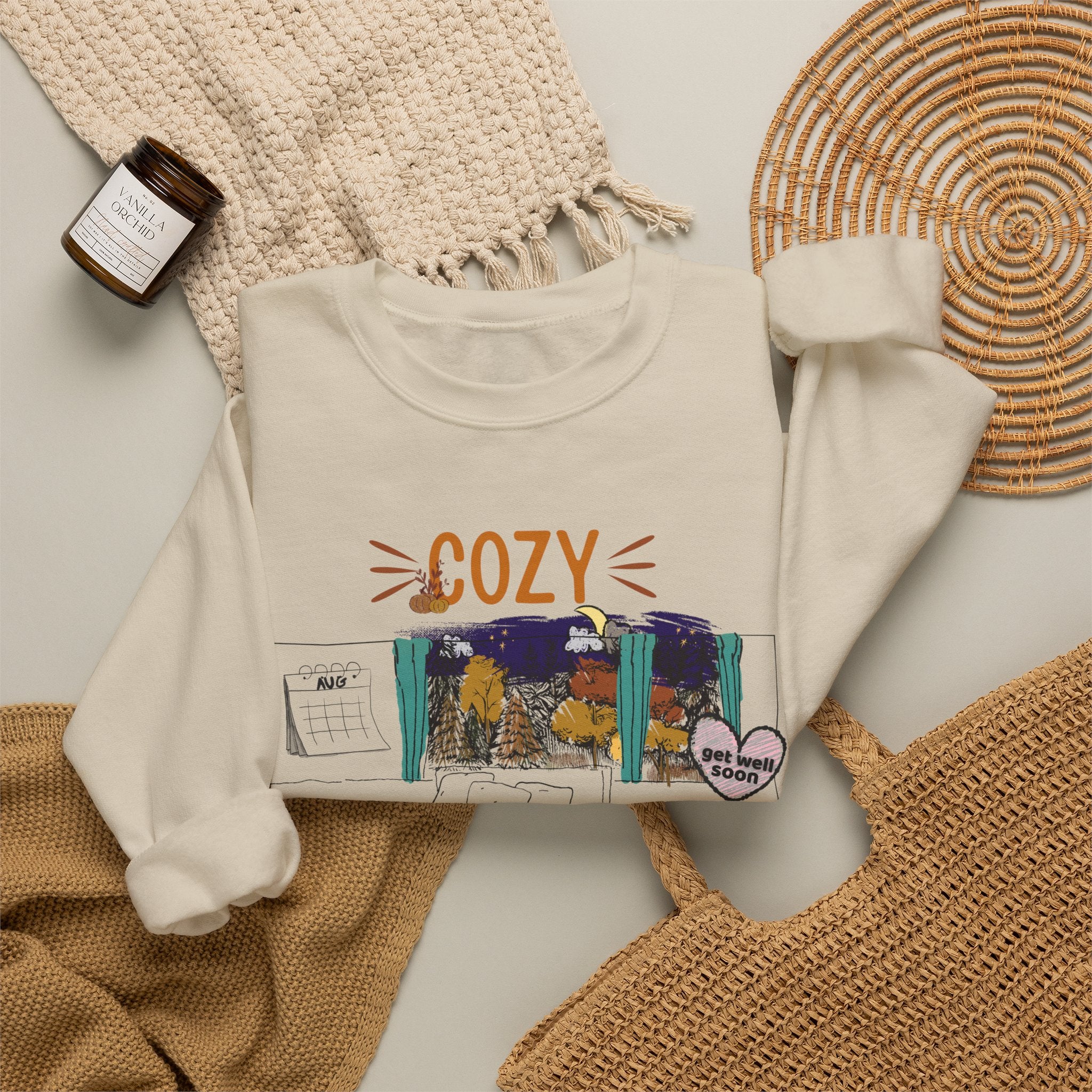 Cozy Within Reason fall crewneck by HKitty Enterprises, a funny autumn bedroom scene with a sleeping cat, a nighttime fall window, and a dying plant getting a get well soon balloon