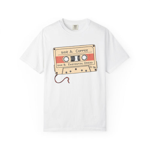 Black garment-dyed tee with vintage cassette tape illustration labeled Coffee & Existential Dread in handwritten marker style — front view