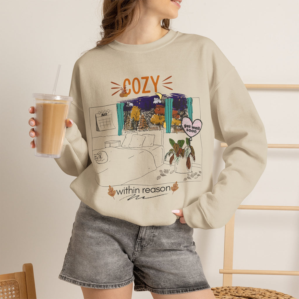 Cozy Within Reason fall crewneck by HKitty Enterprises, a funny autumn bedroom scene with a sleeping cat, a nighttime fall window, and a dying plant getting a get well soon balloon