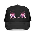 Black foam trucker hat with blushing kawaii anime face design, pink heart eyes, on the front panel — front view